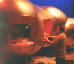 Image: Man kneeling at exhibit- Welcome Wing